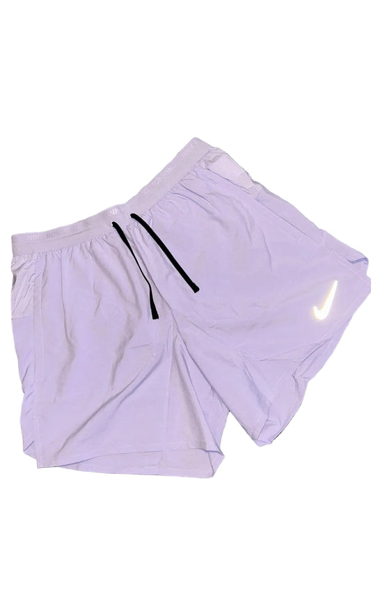 LILAC NIKE STRIDE SHORTS